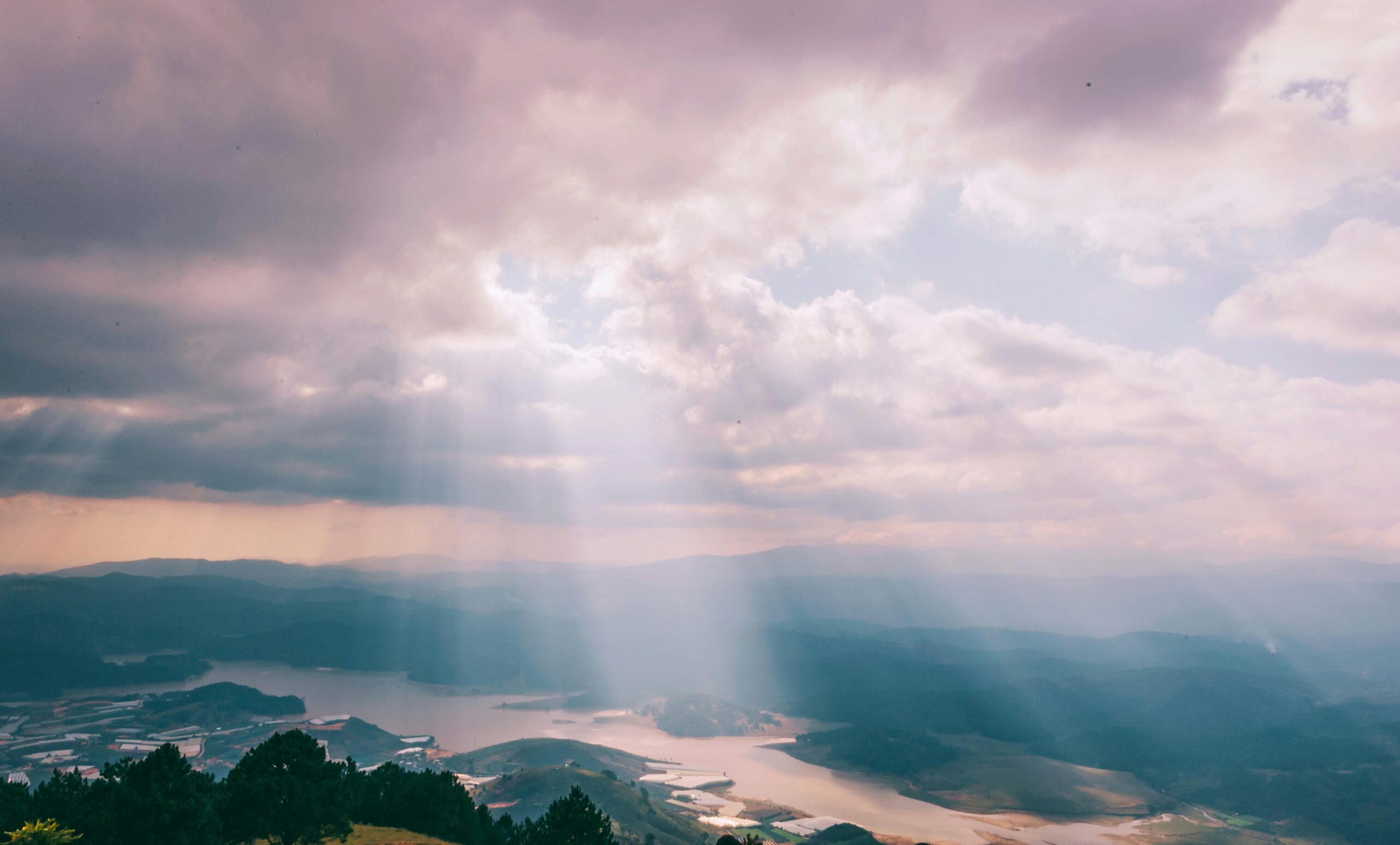 Sun rays breaking through the clouds to show aligning the crown chakra and connection with the universe.